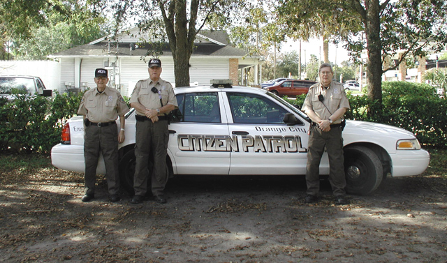 Picture of Volunteers posting in from of Citizens Patrol Vehicle