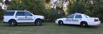 Picture depicting Volunteer SUV and Patrol Car.